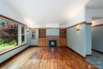 Living rm has built-in shelves near fireplace
