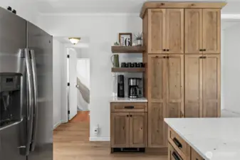 Newer stainless fridge, coffee bar, & ceiling height pantry cabs!