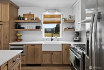 Washing dishes isn't so bad- there is a built in dishwasher, new farm style, granite composite apron sink, and VIEWS of meadows in Roslyn! Watch for the local wildlife.
