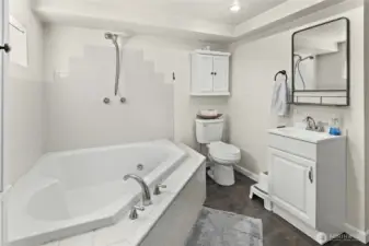 Primary basement bedroom with Full bath- check out that jetted tub!