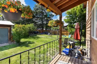 Covered entry area/ back deck spot. Nice garden area with blueberries & strawberries!