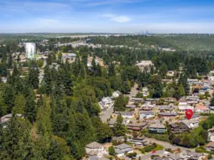 Looking north towards Seattle in the distance. Interstate 5 and the new Sound Transit to the right of the water tower.