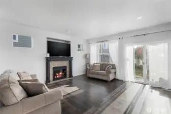 Gas fireplace with 60" TV niche.  Lots of windows for natural lighting.