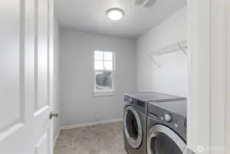 Spacious upstairs utility room.  Washer and dryer included.