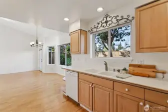 Warm maple cabinets line this open kitchen with plenty of storage and counter space!