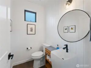 Main floor powder room with shiplap detailing.