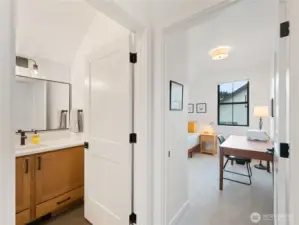 Upstairs full bathroom with tile floors.