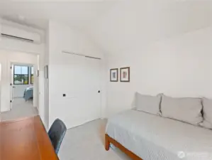 Additional upstairs bedroom looking out to the hallway.