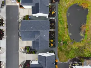 View looking down on the cottage and pond.