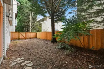 Private, level, fenced back yard