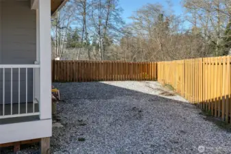 Side yard parking area, hot water spigot to rinse off after the beach