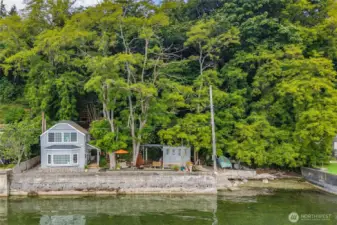 See how the home sits perfectly along the shoreline