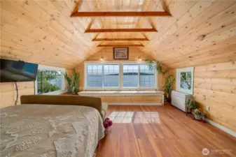 Upstairs retreat with vaulted ceilings and natural light.
