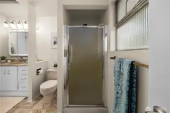 Freestanding shower offering style, comfort, and easy access.