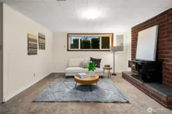 Generous family room with a cozy woodstove—perfect for relaxing.