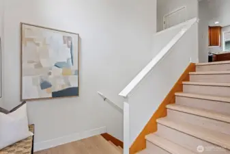 The entry provides room for a bench and hooks to shed shoes and coats.