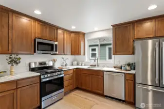 The kitchen also features a brand new stainless stove/oven and refrigerator.  The dishwasher & microwave are newer as well.