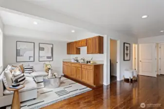 Relax in this spacious lower level rec room with partial kitchen, how convenient.  There is a range plug-in should someone want a full kitchen.