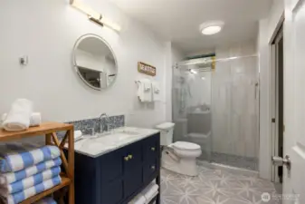 3/4 bath in the lower level with laundry.  (washer and dryer do not convey)
