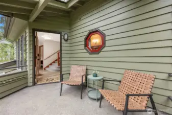 Take a moment and relax as you open the door under the protection of a covered front porch.
