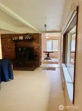 View from Far Wall of Living Room Towards Kitchen