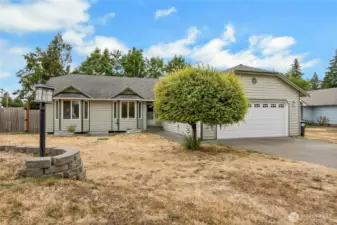 Yard was tiered to allow for rv/boat parking access to side of home behind gate.