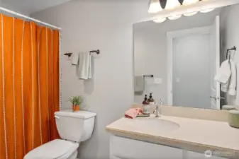 Shared full bath in hallway.