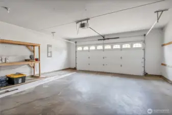 2 car garage with insulated door w/new 3/4 hp motor door opener.