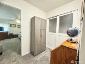 Office area sliding doors lead to the laudry are.