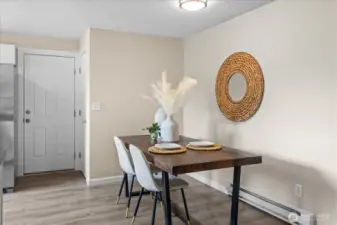 Dining space off kitchen has ample space for hosting!