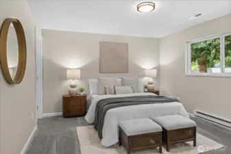 Primary bedroom offers spacious room with large window to the backyard.