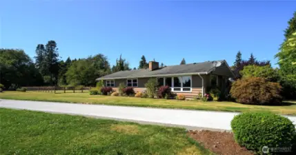 Classic Birch Bay home sits on a flat 1/2 acre lot overlooking the bay