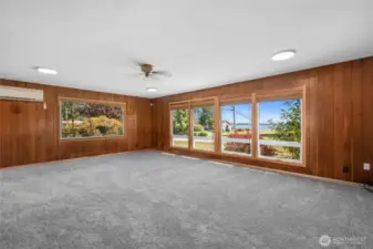 Bright living room has delightful bay views