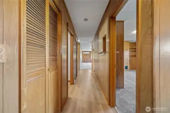 Paneled hallway with laminate flooring