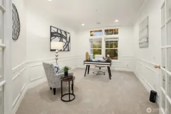 French doors lead to the main floor den.