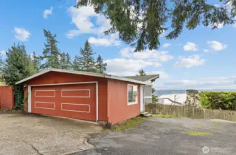 2-Car garage (with views southward) could be remodeled and raised to include upper space.