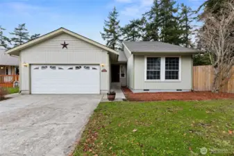 This charming single-level home welcomes you with a tidy façade, attached garage, and a peaceful Northwest setting—perfect for easy living and everyday comfort.