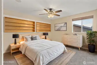 Bedroom #3 showing built-in shelves, updated ceiling fan and light fixture.