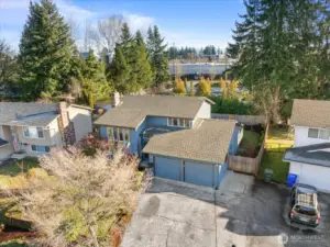 The house is located in a quiet neighborhood with sidewalks, curbs and paved streets.