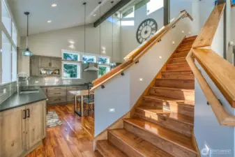 Live edge Island Maple on banister and in kitchen.
