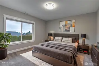 Virtually Staged photo of 3rd bedroom downstairs.