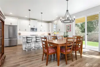 The dining area off the kitchen offers plenty of space and can easily be extended—perfect for hosting family gatherings, holiday dinners, or even Thanksgiving at your home!