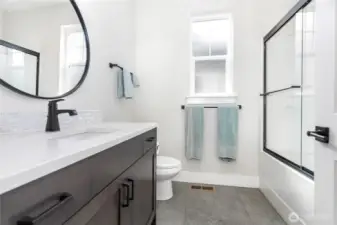 A full-size bathroom conveniently located near the other two bedrooms, perfect for family or guests.