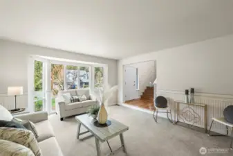 Formal living room with large picture windows.