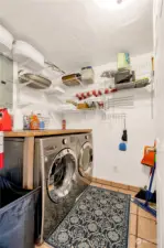 Large washer and dryer in designated utility room .