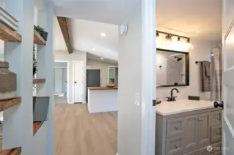 A view down the main hallway leading into the open living areas.