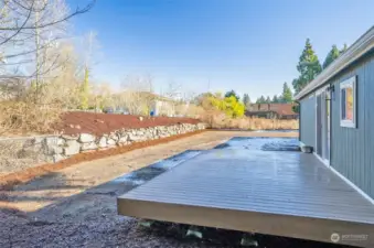 A beautifully terraced backyard with ample space for recreation and relaxation. Back yard was newly seeded for a lush lawn in the Spring