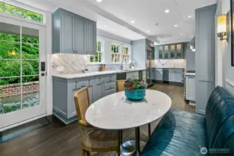 A chef’s domain with soul and sophistication. This reimagined Kitchen flows through zones of culinary function and conviviality—anchored by a custom leather Banquette and rounded marble table. Wrapped in soft slate hues with brass accents, the space feels simultaneously serene and alive.