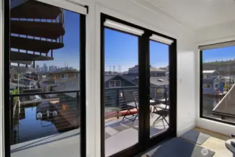 New windows easy to open to the second deck off of second floor living room.  No need to travel through a bedroom to get to your rooftop.