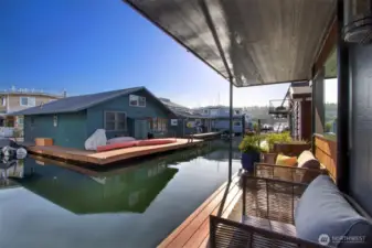 Dreamy summer days on one of three south facing decks.  We love that this one is covered and right outside the bedrooms.